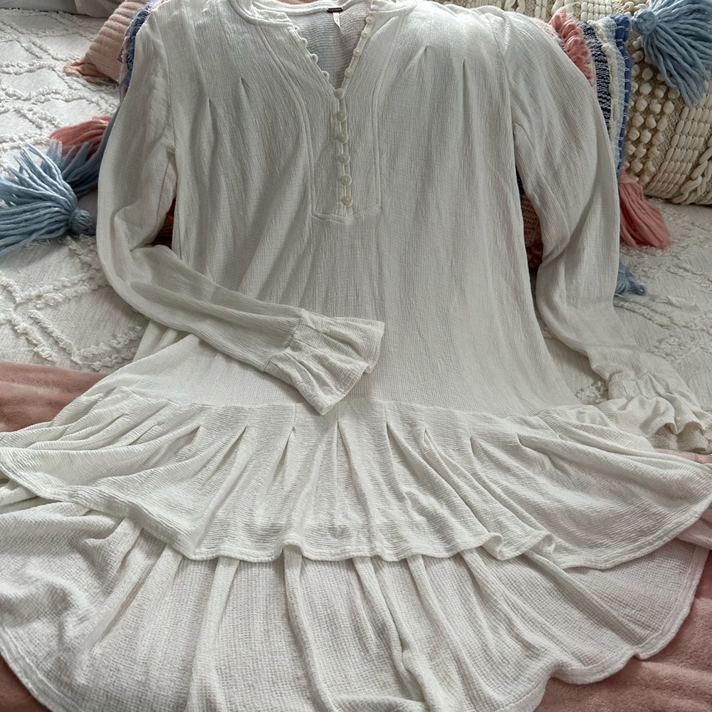 White long sleeve light weight free people dress with a little ruffle.